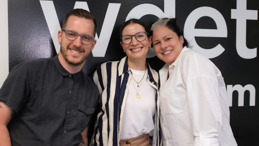 Warda Bouguettaya (middle) poses with "Essential Cooking" hosts Ann Delisi and Chef James Rigato at WDET's studios.
