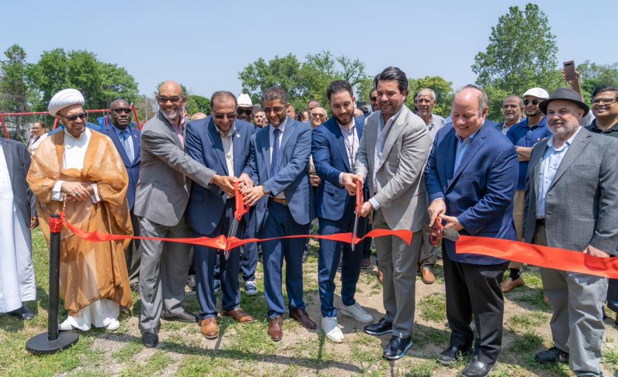 Community members perform a ribbon-cutting ceremony at Muhammad Ali Park in Detroit