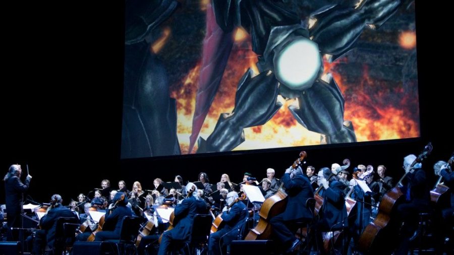 A symphony performs onstage in front of a Final Fantasy graphic