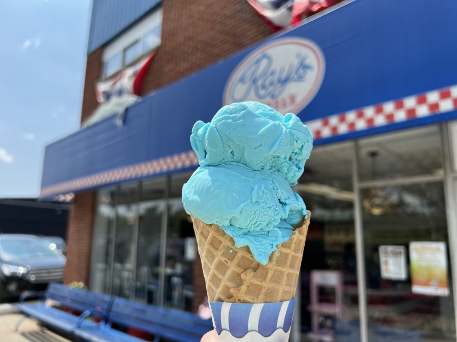 A double scoop of Blue Moon ice cream in a waffle cone