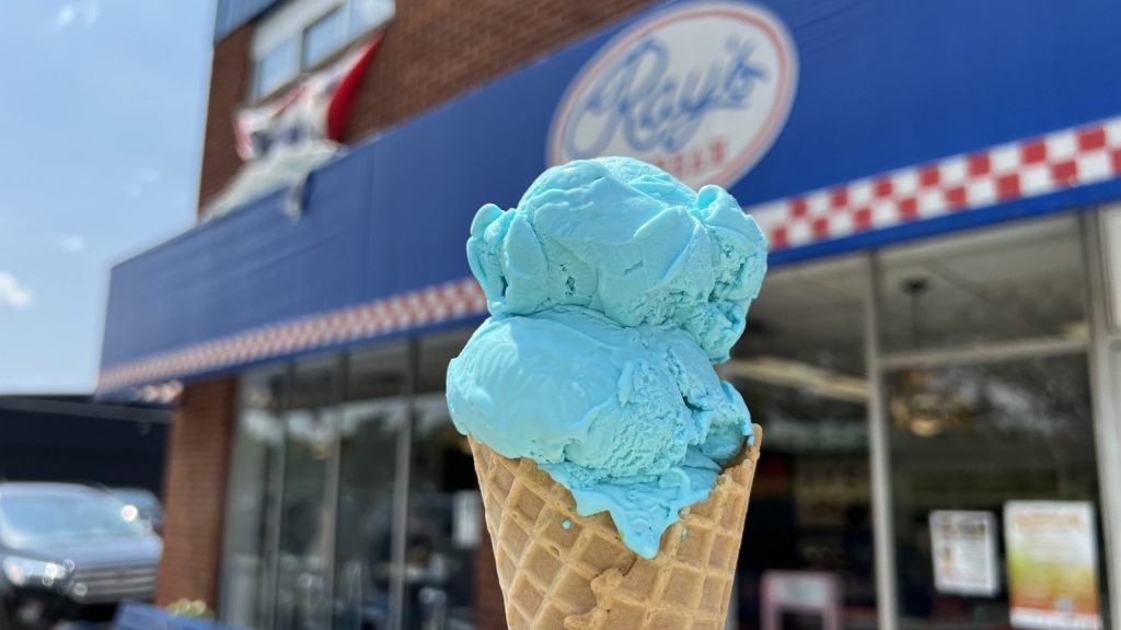 A double scoop of Blue Moon ice cream in a waffle cone