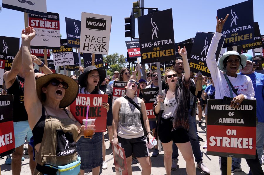 Striking writers and actors take part in a rally outside Paramount studios in Los Angeles