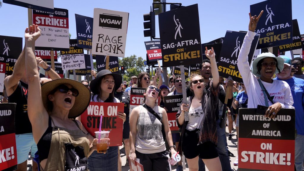 Striking writers and actors take part in a rally outside Paramount studios in Los Angeles