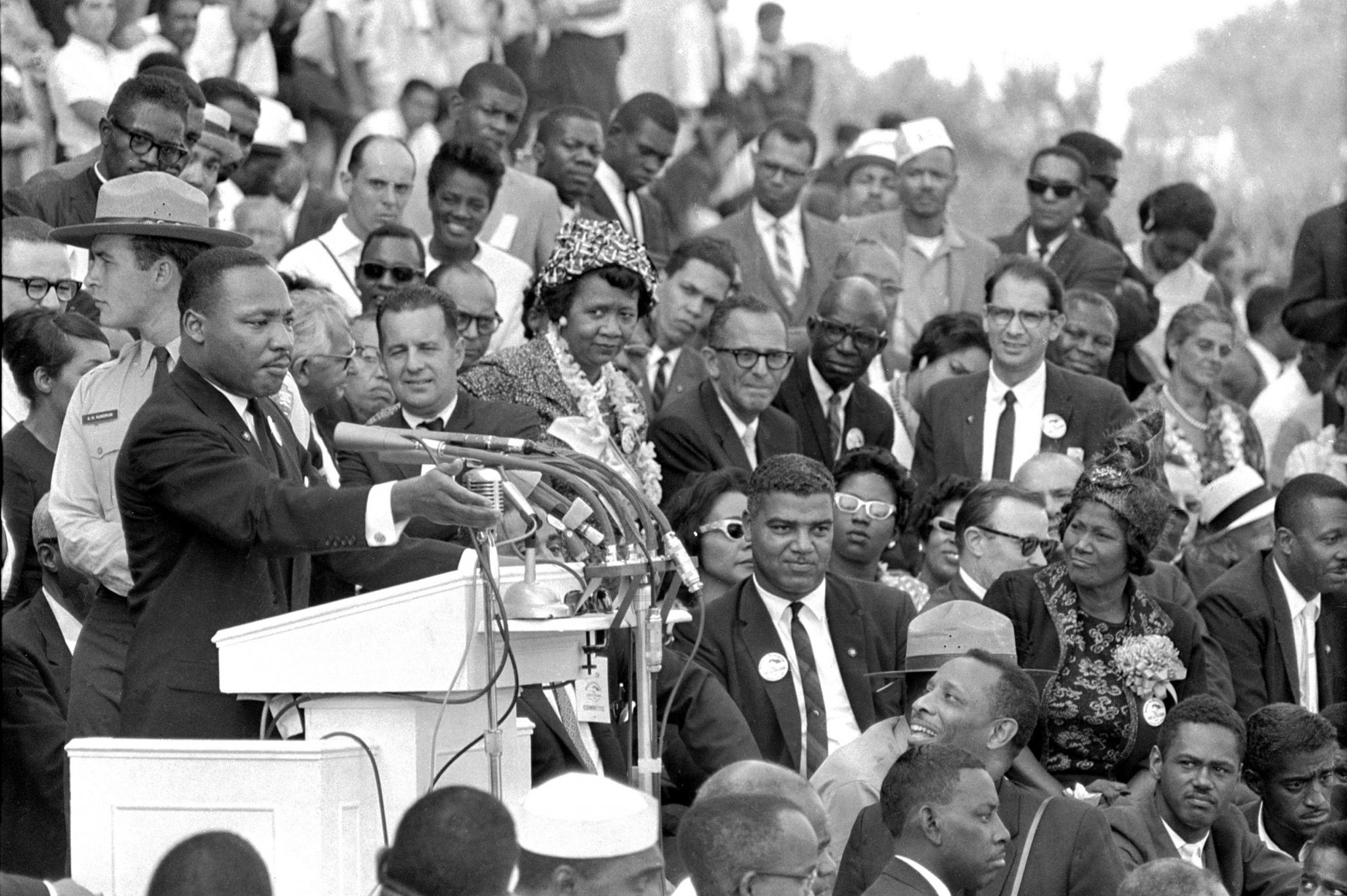 Black and white photo of MLK delivering his "I Have a Dream" speech in 1963