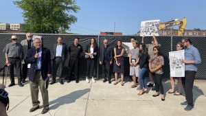 Members and supporters of the Asian American community speak out against the demolition of a 140-year-old building in Detroit's former Chinatown neighborhood on July 31, 2023.