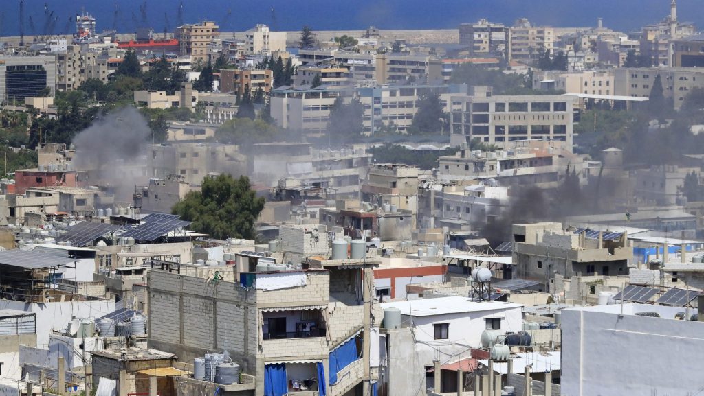 FILE - Smoke rises during a third day of clashes that erupted between members of the Palestinian Fatah group and Islamist factions in the Palestinian refugee camp of Ein el-Hilweh near the southern port city of Sidon, Lebanon, on July 31, 2023.