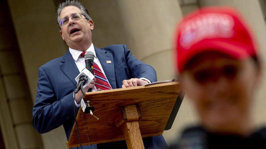 FILE - Matthew DePerno, Republican candidate for Michigan attorney general, speaks during a rally at the Michigan state Capitol, Oct. 12, 2021, in Lansing, Mich.