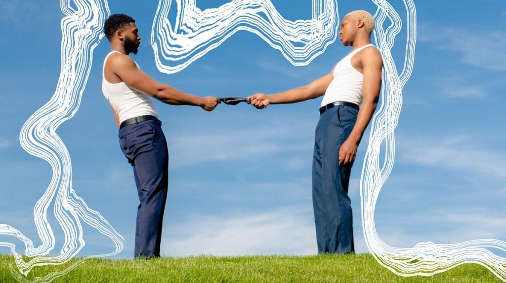Artful photograph of two Black leaning away from each other in a field outlined by white ripples.