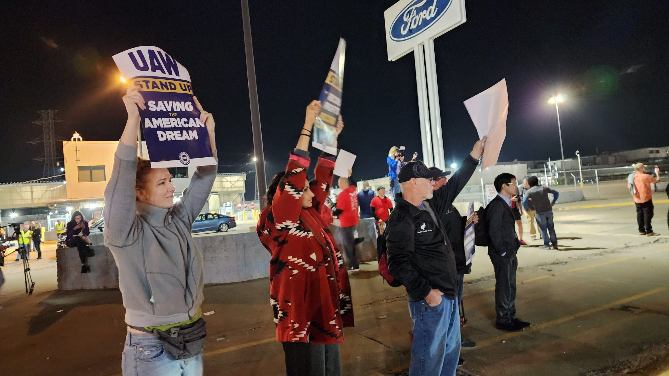 UAW members picket outside Ford's assembly plant in Wayne, Mich.