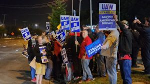 Auto workers picket outside Ford's assembly plant on Sept. 15, 2023, in Wayne, Mich.