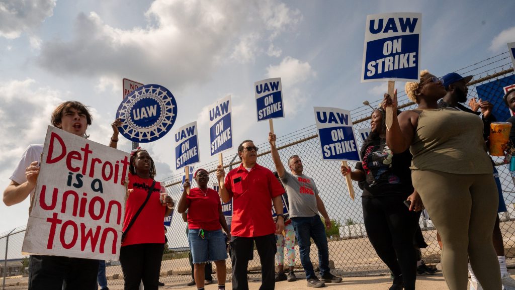 Striking workers picket near a Mopar Parts Distribution Center in Center Line, Michigan.
