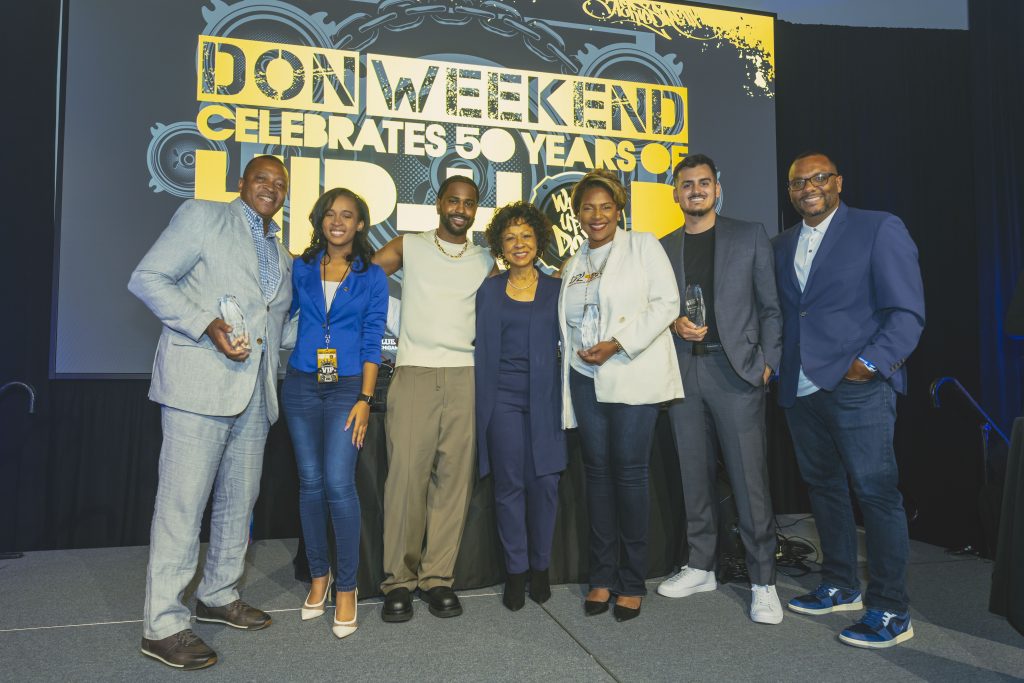 Big Sean poses with his mother and Detroit representatives at DON Weekend 2023