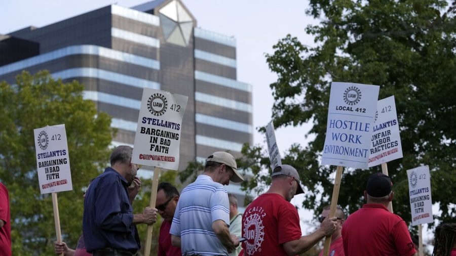 United Auto Workers march outside the Stellantis North American Headquarters, Wednesday, Sept. 20, 2023, in Auburn Hills, Mich.