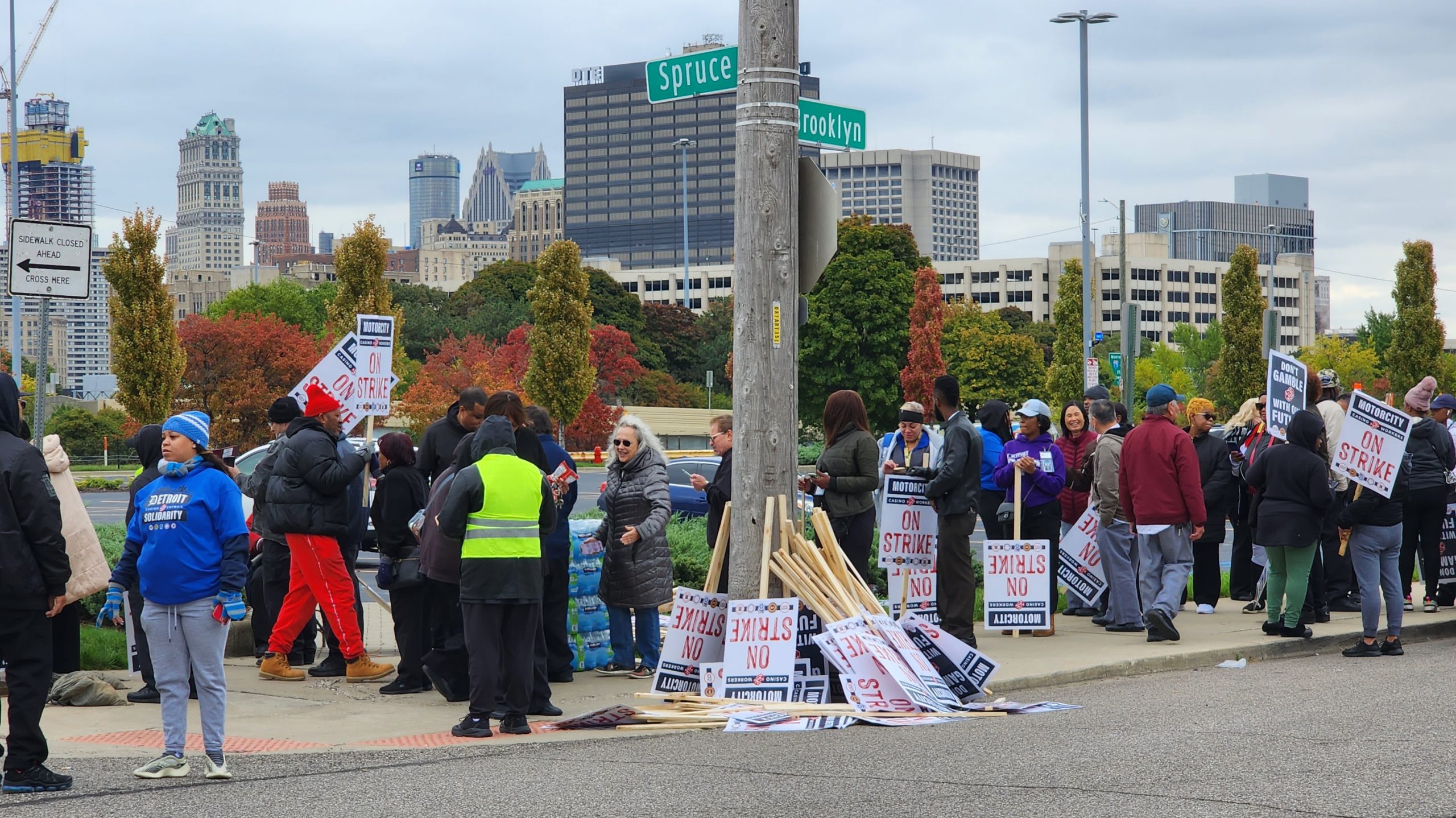 Workers distribute picket signs at the corner of Spruce St. and Brooklyn St. in Detroit.