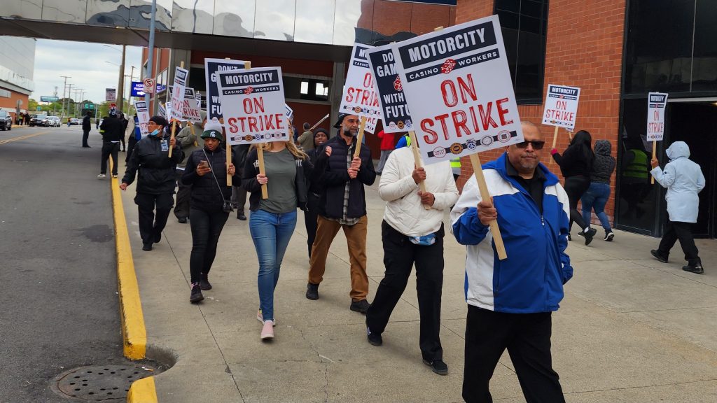 A line of striking workers picket outside of MotorCity Casino.