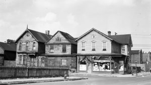 A view of St. Antoine Street at Winder near Detroit's Black Bottom neighborhood. In view are a number of residential buildings, as well as Abe's Market.
