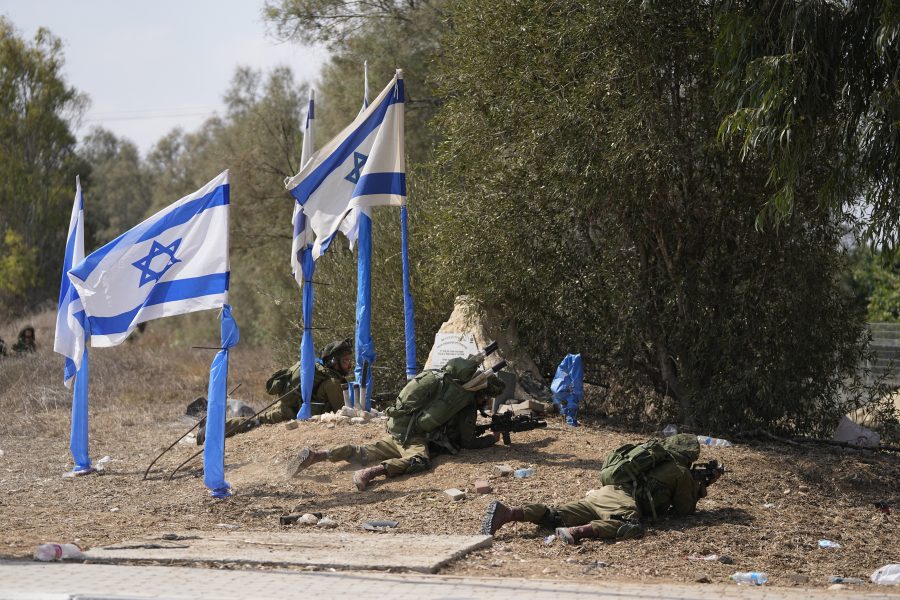 Israeli soldiers take positions in kibbutz Kfar Azza on Tuesday, Oct. 10, 2023. Hamas militants overran Kfar Azza on Saturday, where many Israelis were killed and taken captive.