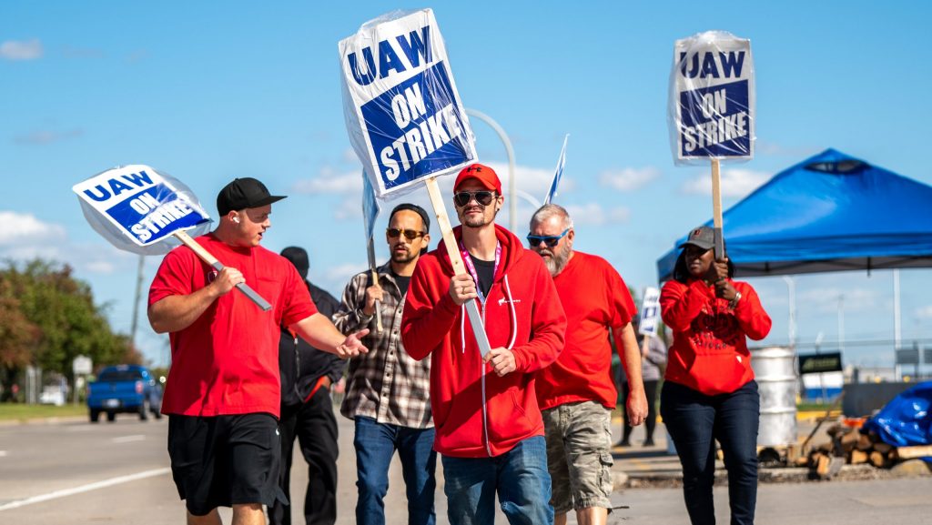 UAW members strike outside the Ford Assembly Plant in Wayne on Friday, Oct. 6, 2023.