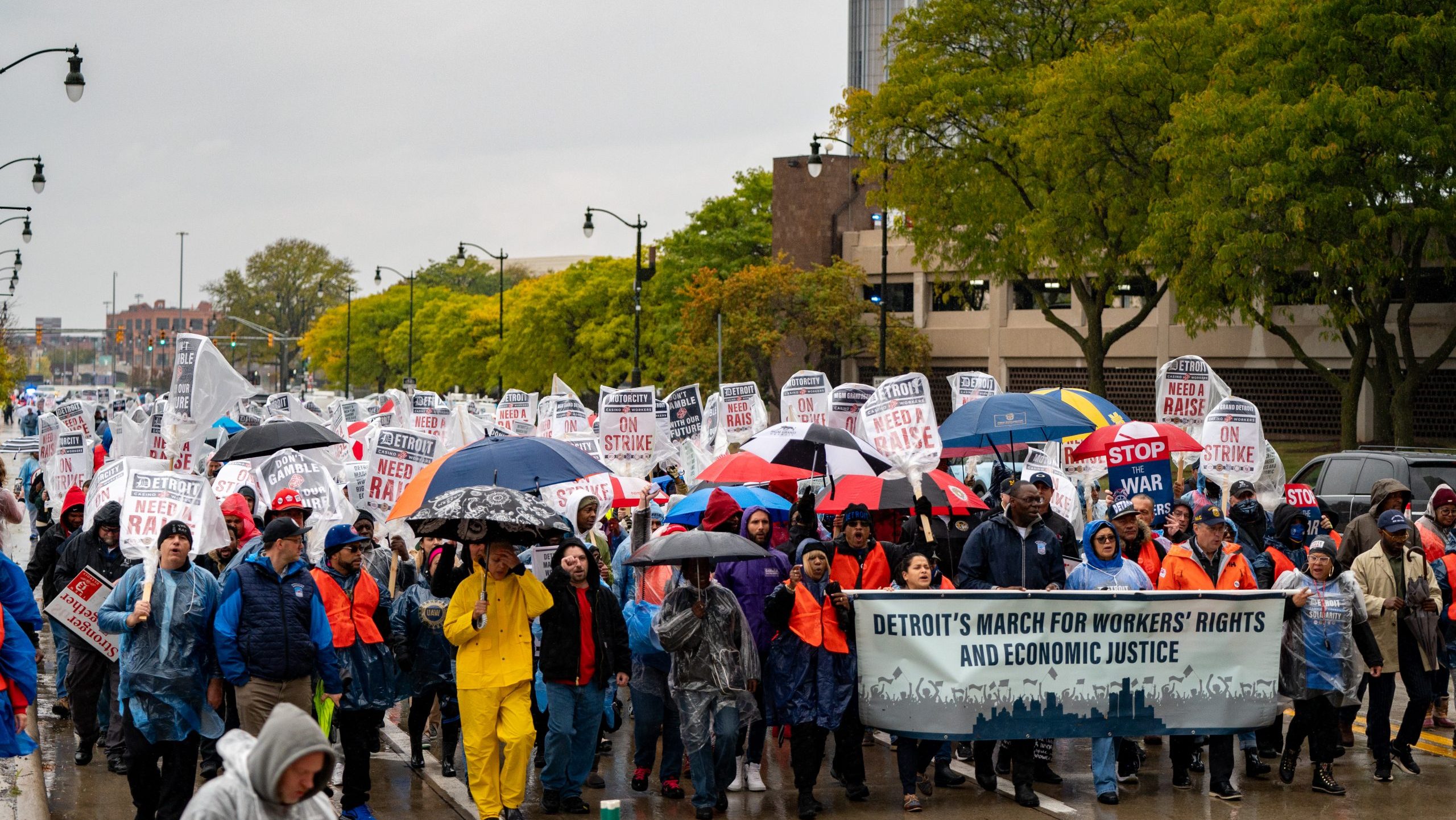 Striking union members and supporters march in Detroit to rally for a new contract on Oct. 19, 2023.