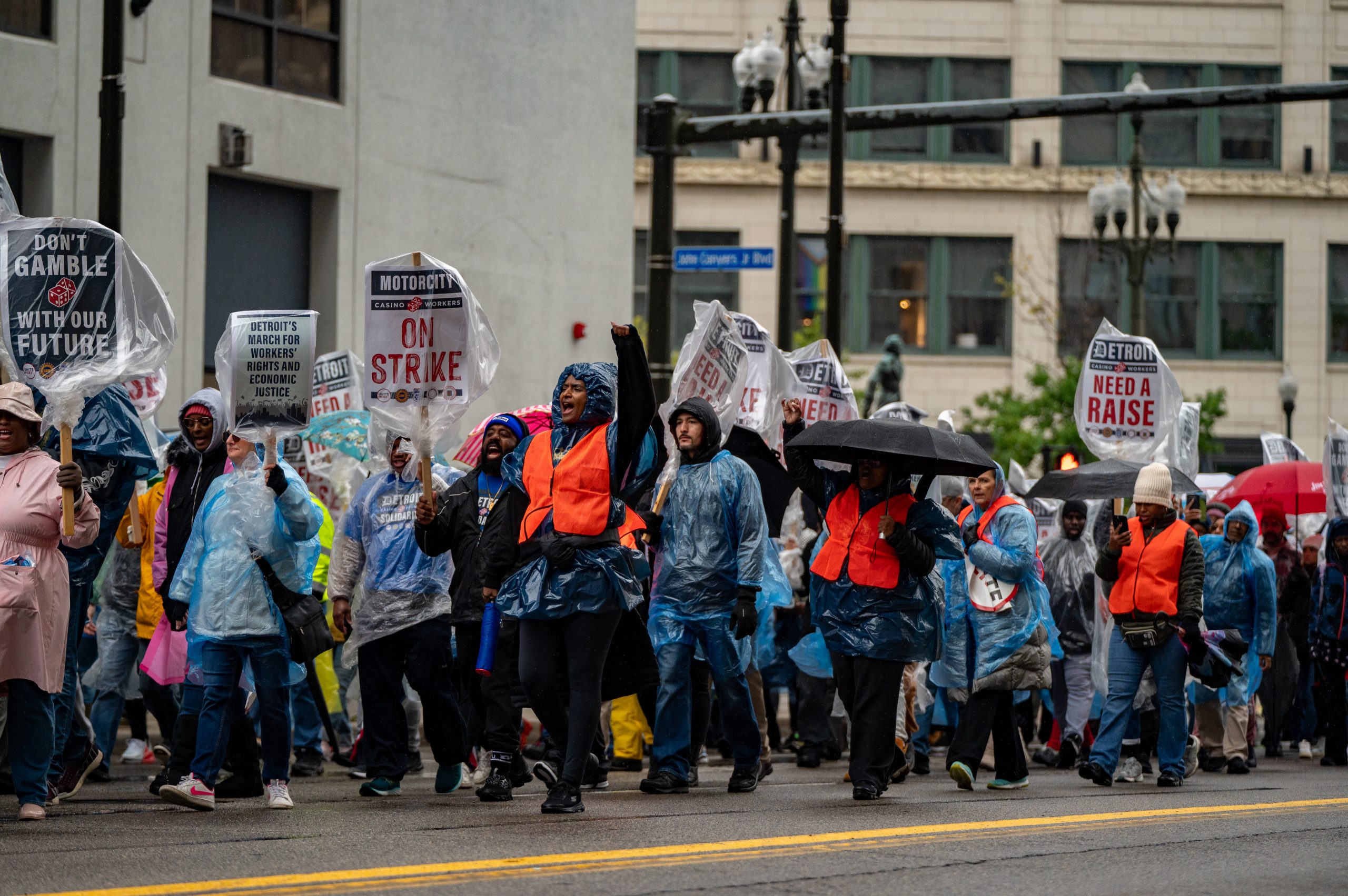 Striking union members and supporters march in Detroit to rally for a new contract on Oct. 19, 2023.