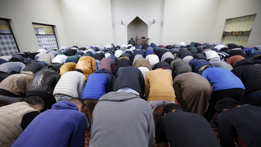 Men pray during Friday prayers, Friday, Oct. 13, 2023, at the Islamic Center of East Lansing in East Lansing, Mich.