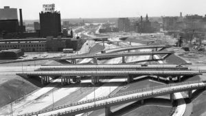 A view of the construction of the Chrysler Freeway at the Fisher interchange, under Vernor, 1964.