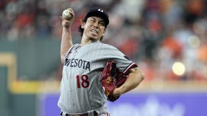 FILE - Minnesota Twins relief pitcher Kenta Maeda throws during the fourth inning in Game 1 of an American League Division Series baseball game against the Houston Astros, Oct. 7, 2023, in Houston.