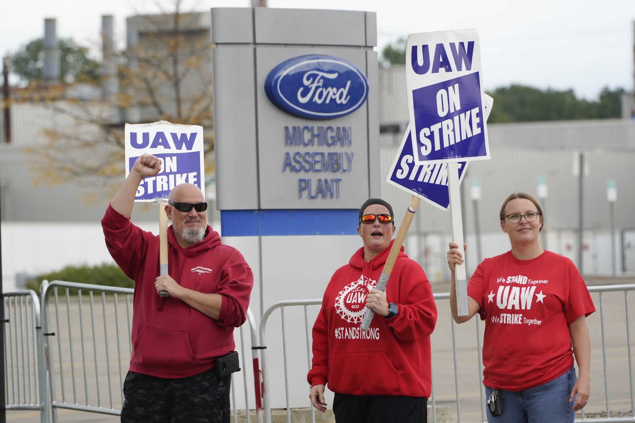 FILE - United Auto Workers members walk the picket line at the Ford Michigan Assembly Plant in Wayne, Mich., Sept. 26, 2023.