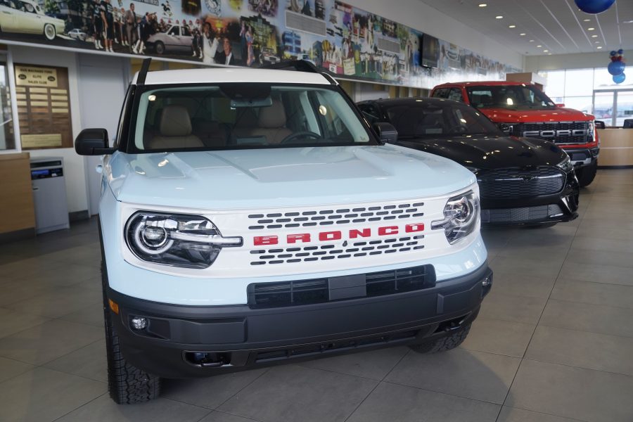 File -A Ford Bronco is displayed at a Gus Machado Ford dealership on Jan. 23, 2023, in Hialeah, Fla. New union agreements with Detroit automakers reached during the past week will cost Ford, Stellantis and General Motors over $1 billion per year by the time they take effect in four years.