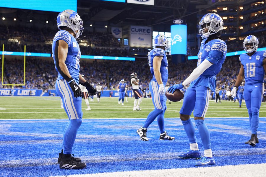 Detroit Lions wide receiver Jameson Williams (9) celebrates his touchdown with wide receiver Amon-Ra St. Brown (14) against the Chicago Bears during an NFL football game at Ford Field in Detroit, Sunday, Nov. 19, 2023.