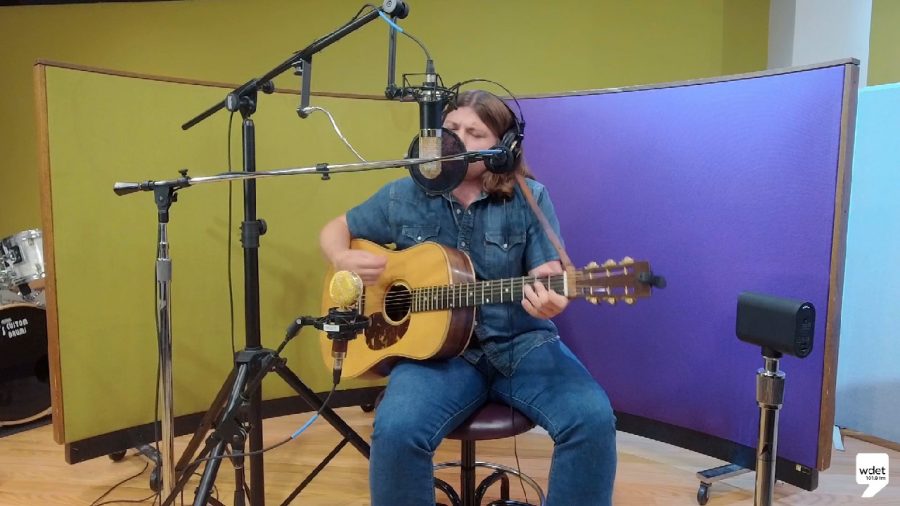 Myron Elkins sings and plays acoustic guitar in WDET's studios