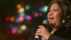 FILE - In this Dec. 4, 2008 file photo, Aretha Franklin performs during the 85th annual Christmas tree lighting at the New York Stock Exchange in New York.