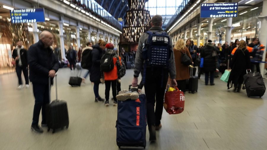 Travellers queue for the Eurostar trains at St Pancras Station in London, Friday, Dec. 22, 2023.