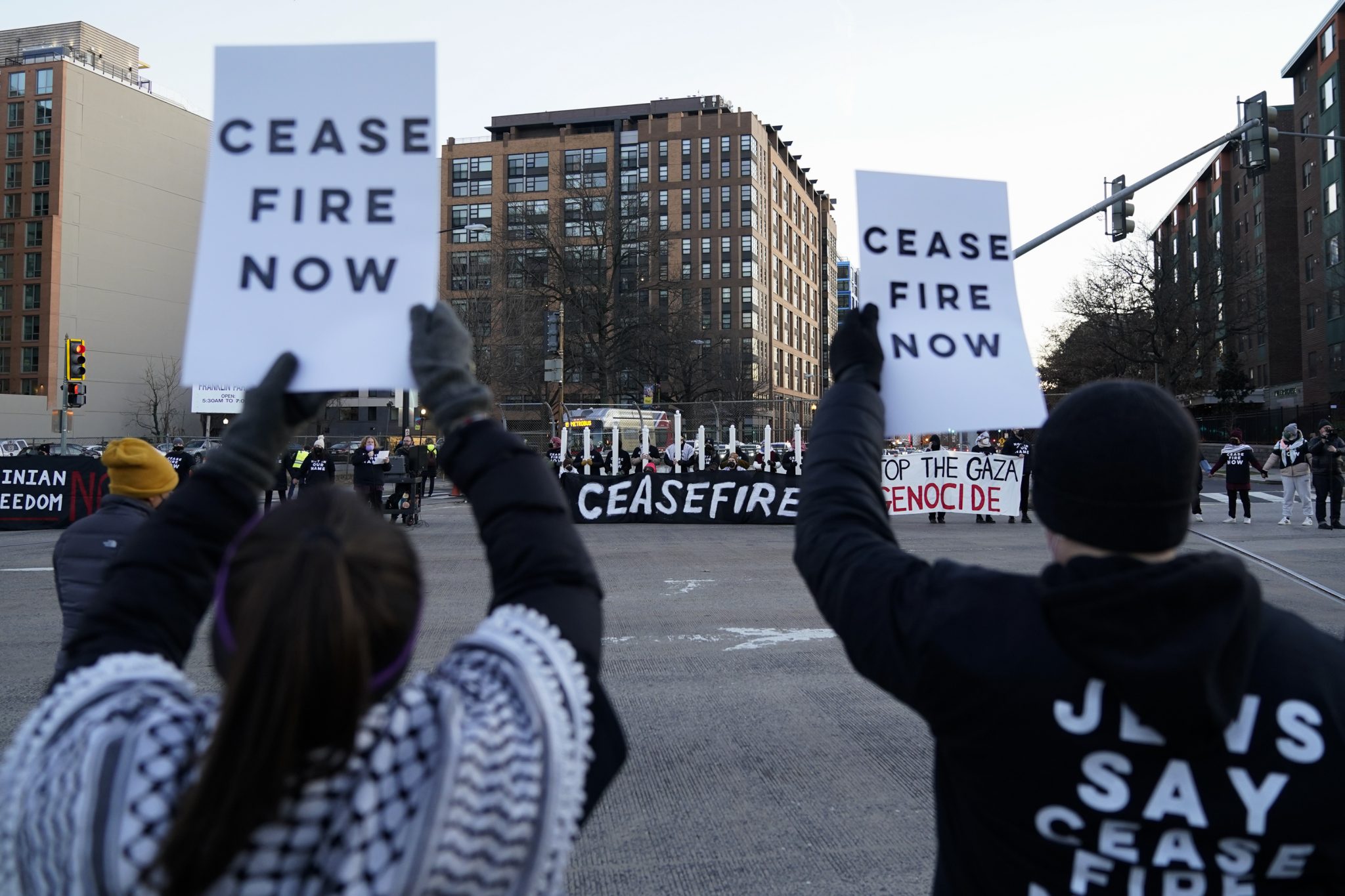 Protestors calling for a ceasefire in the Israel-Hamas war block traffic on New York Avenue NW in Washington, Thursday, Dec. 14, 2023.