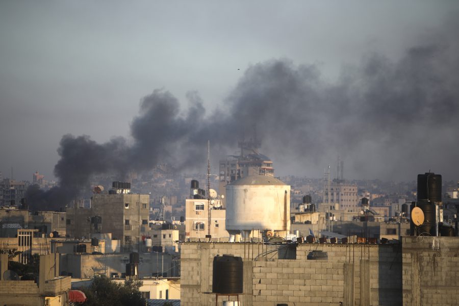 Smoke rises from town of Khan Younis after Israeli strikes on Friday, Dec. 15, 2023.