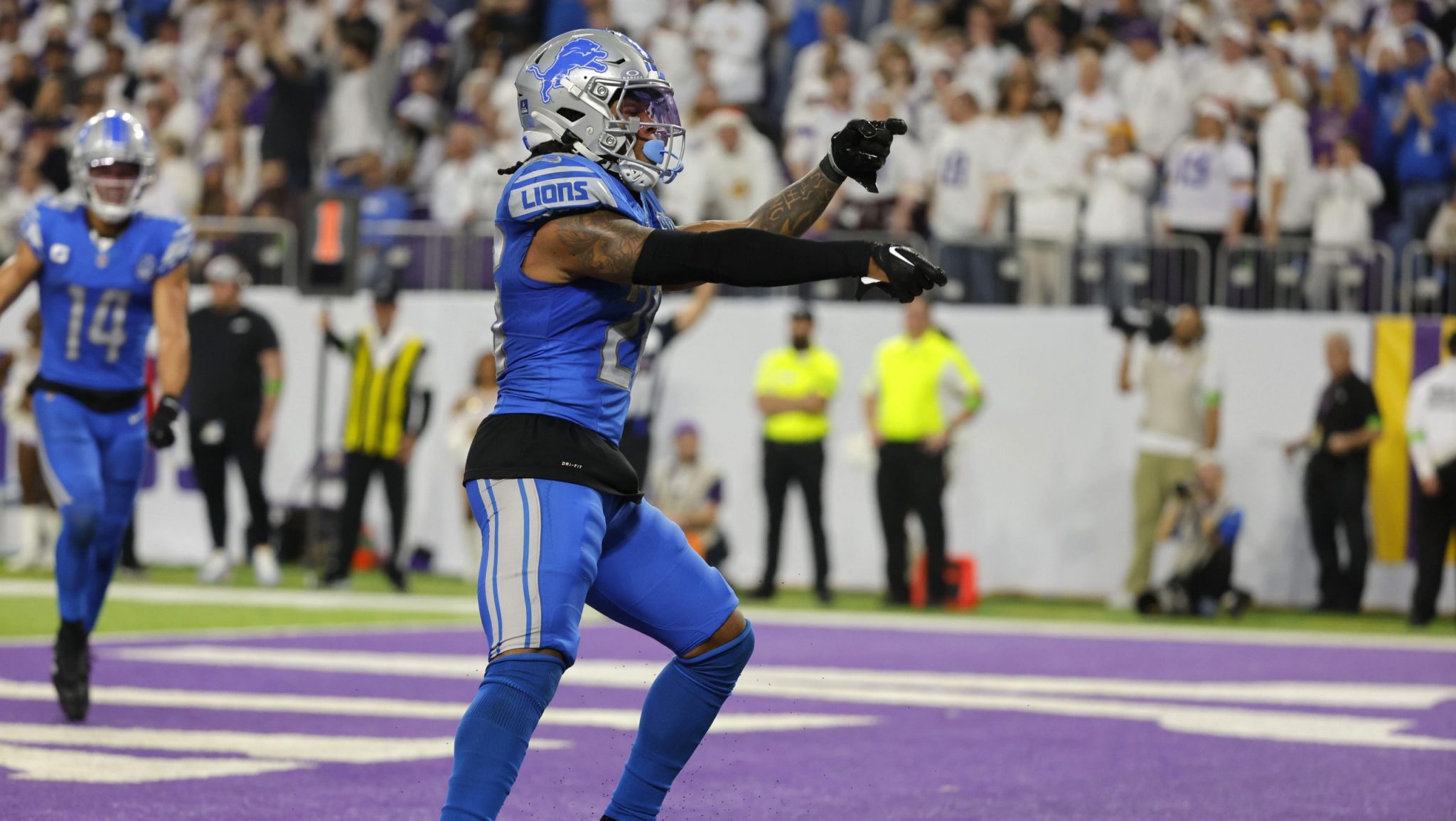 Detroit Lions running back Jahmyr Gibbs (26) celebrates after scoring on a 3-yard touchdown run during the second half of an NFL football game against the Minnesota Vikings, Sunday, Dec. 24, 2023, in Minneapolis.