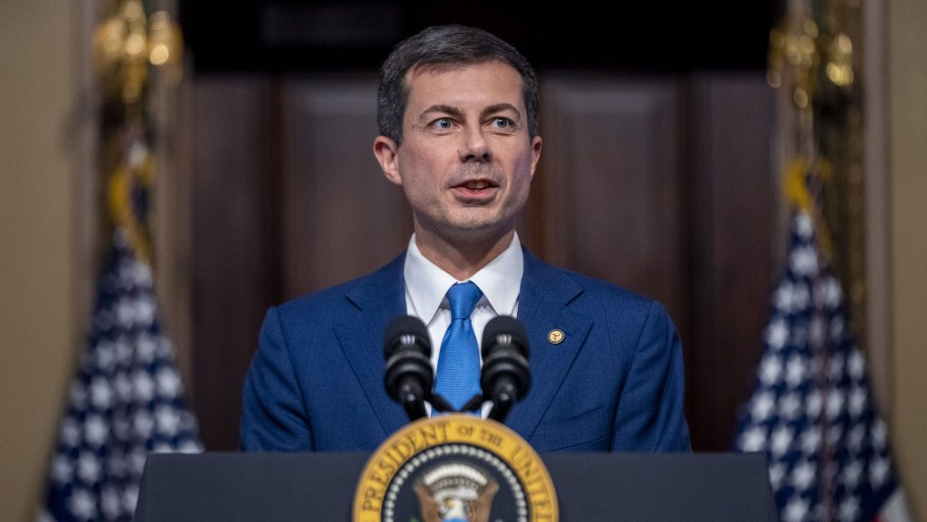 Transportation Secretary Pete Buttigieg, accompanied by President Joe Biden, speaks about supply chain issues in the Indian Treaty Room on the White House complex in Washington, Monday, Nov. 27, 2023.