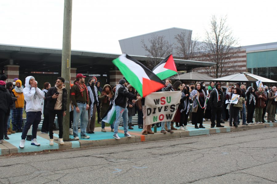 Students gathered outside the Wayne State University Board of Governors meeting on Thursday, Dec. 7, to demand the university's divestment from companies that profit from war.