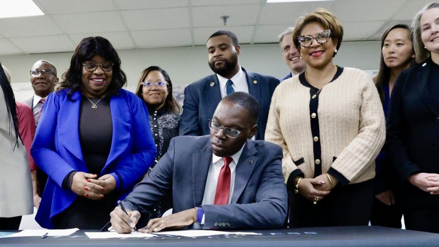 Lt. Gov. Garlin Gilchrist sign a slate of bills into law in December that aim to reform the state's juvenile justice system.