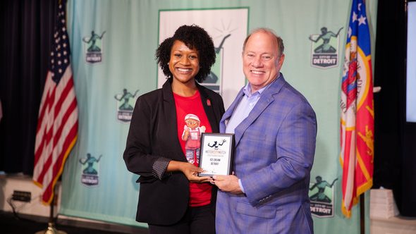 Detroit Mayor Mike Duggan poses with past Motor City Match grant awardee Ysahai Honor-Marie, owner of Ice Cream Detroit.