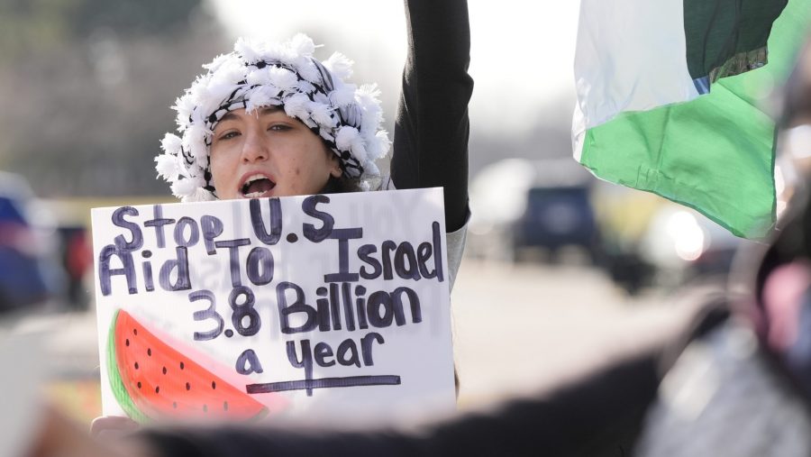 Amana Ali joins about three dozen people protesting Israel's attacks in Gaza, Thursday, Feb. 8, 2024 in Dearborn, Mich. The protesters gathered hoping to be heard by members of the Biden White House who were scheduled to meet in suburban Detroit with Muslim and Arab American leaders.