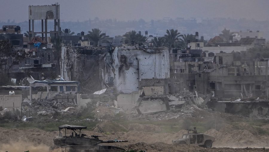 Israeli soldiers operate inside the Gaza Strip, as seen from southern Israel, Tuesday, Feb. 13, 2024. The army is battling Palestinian militants across Gaza in the war ignited by Hamas' Oct. 7 attack into Israel.