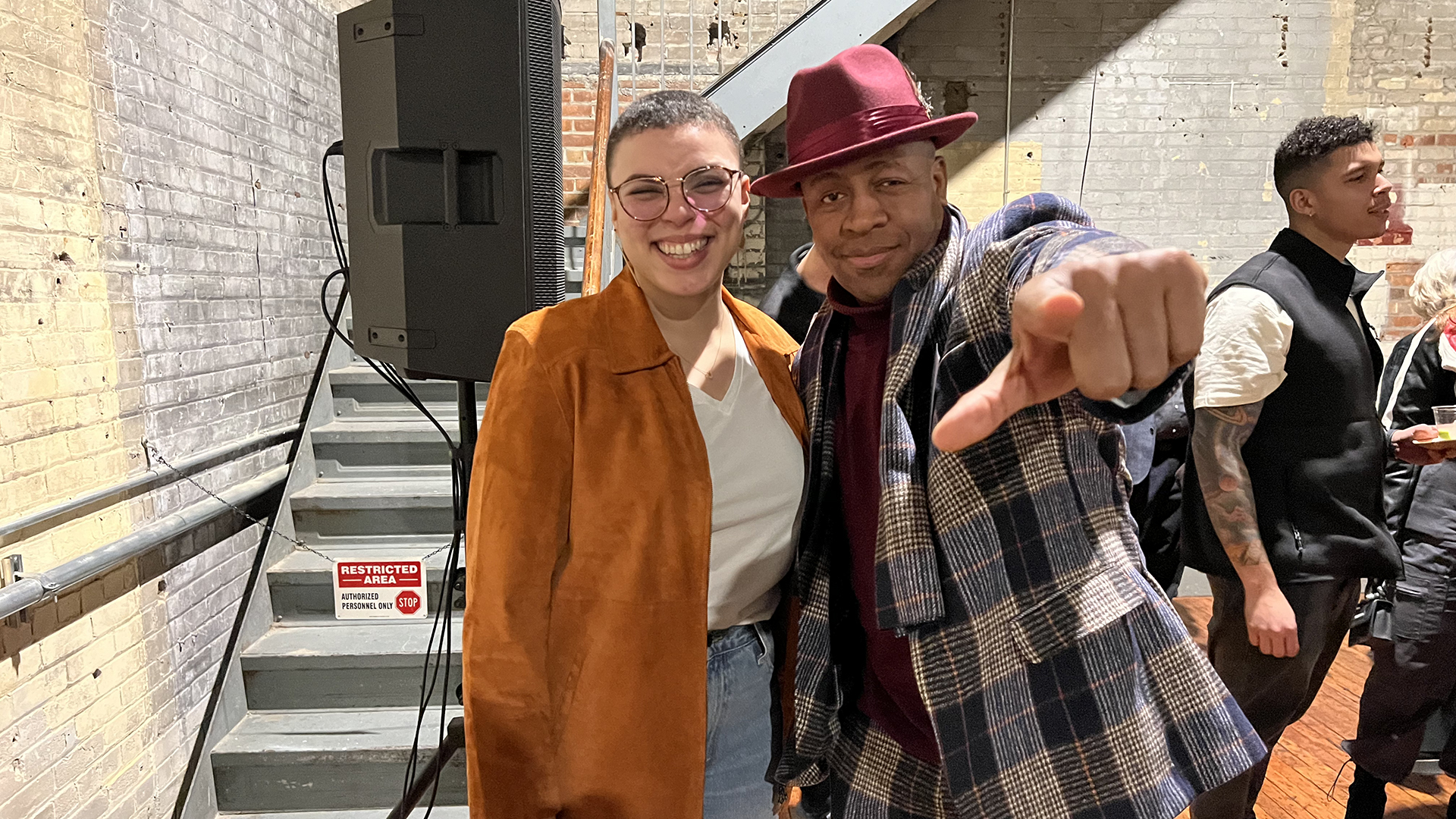 "Visions" host Kaleigh Wilder and "The Progressive Underground" host Chris Campbell pose for a photo during WDET's 75h anniversary party on Feb. 13, 2024, at the Jam Handy in Detroit.