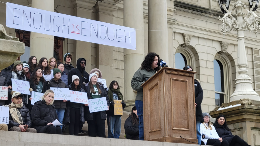 MSU student Maya Manuel addresses a gathering of MSU students and supporters outside the Michigan state Capitol.