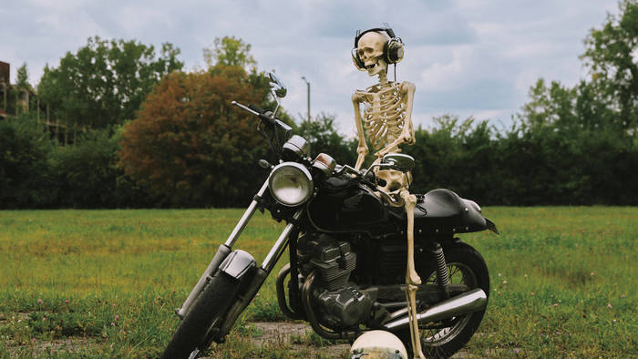 Skeleton on a motorcycle