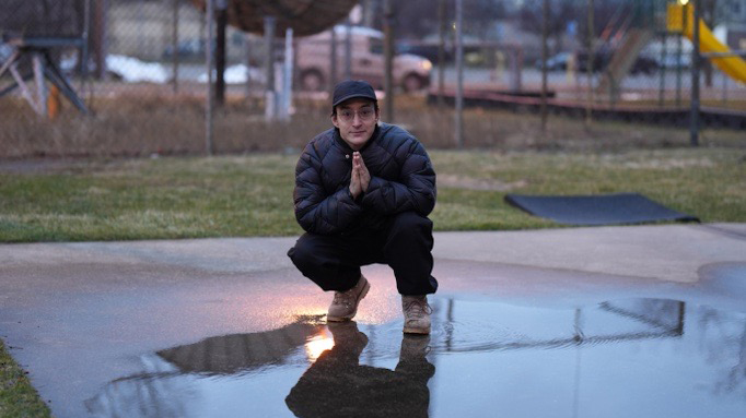 Shigeto posing in front of the WDET tower