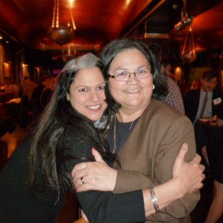 Ann Delisi (left) poses with WDET's Associate Director of Philanthropy Carmen Garcia during a donor event at Cliff Bell's in Detroit in 2010.