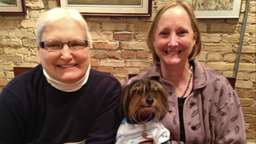 Marsha Caspar and Glenna DeJong with Frizzy. They were the first same-sex couple married in Michigan on March 22, 2014, after a federal judge struck down the state’s same-sex marriage ban.