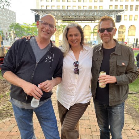 From left to right: WDET hosts Rob Reinhart, Ann Delisi and Jon Moshier pose for a photo at WDET's Sounds Like Detroit concert on Aug. 11, 2023, at New Center Park in Detroit.
