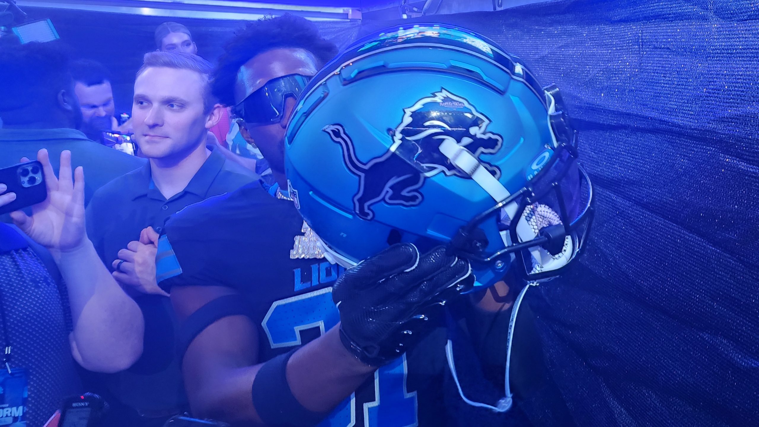 Detroit Lions safety Kerby Joseph holds up the team's redesigned helmet at Ford Field in Detroit on April 18, 2024.
